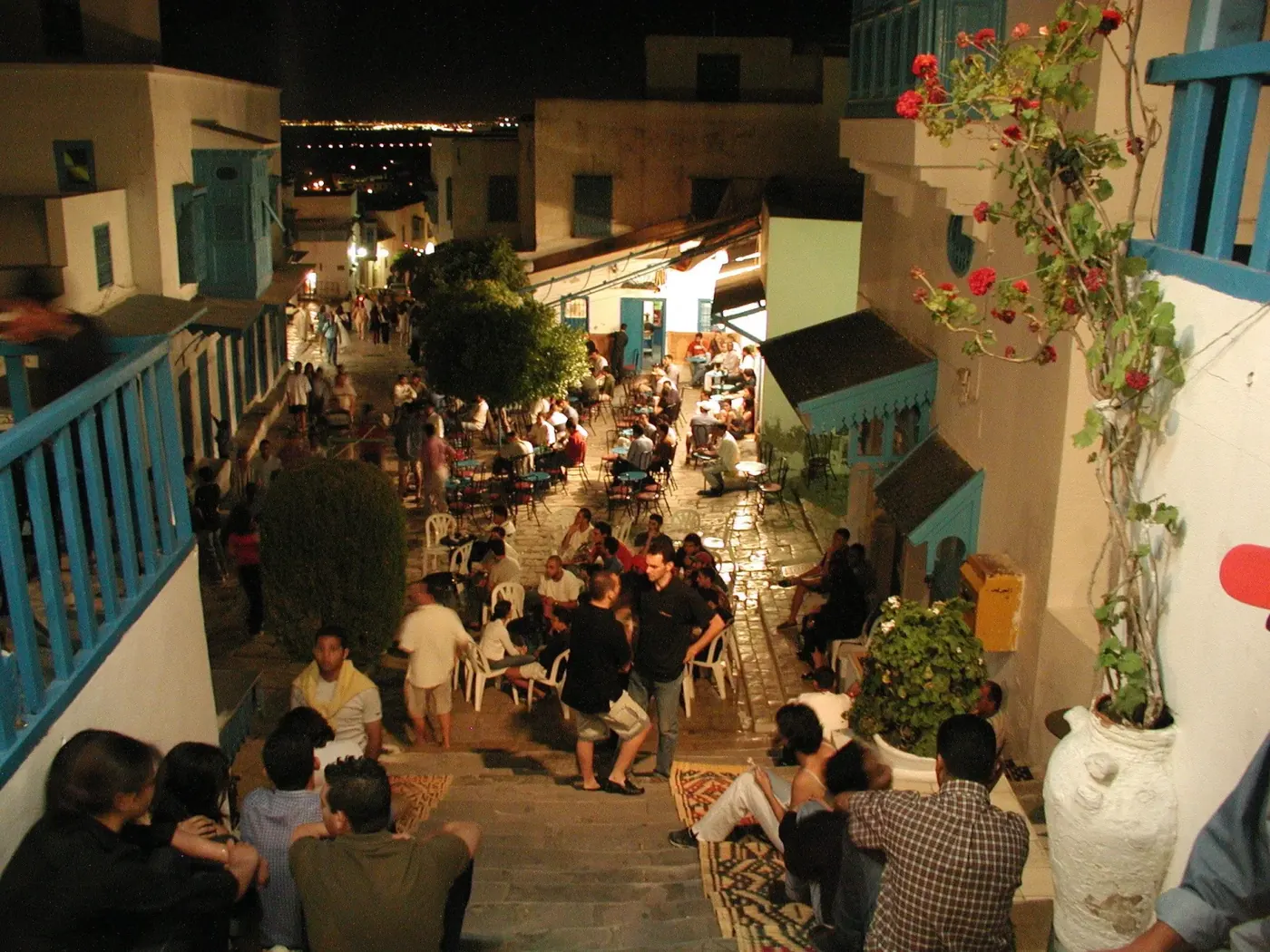 A busy café terrace in Sidi Bou Said filling up at dusk
