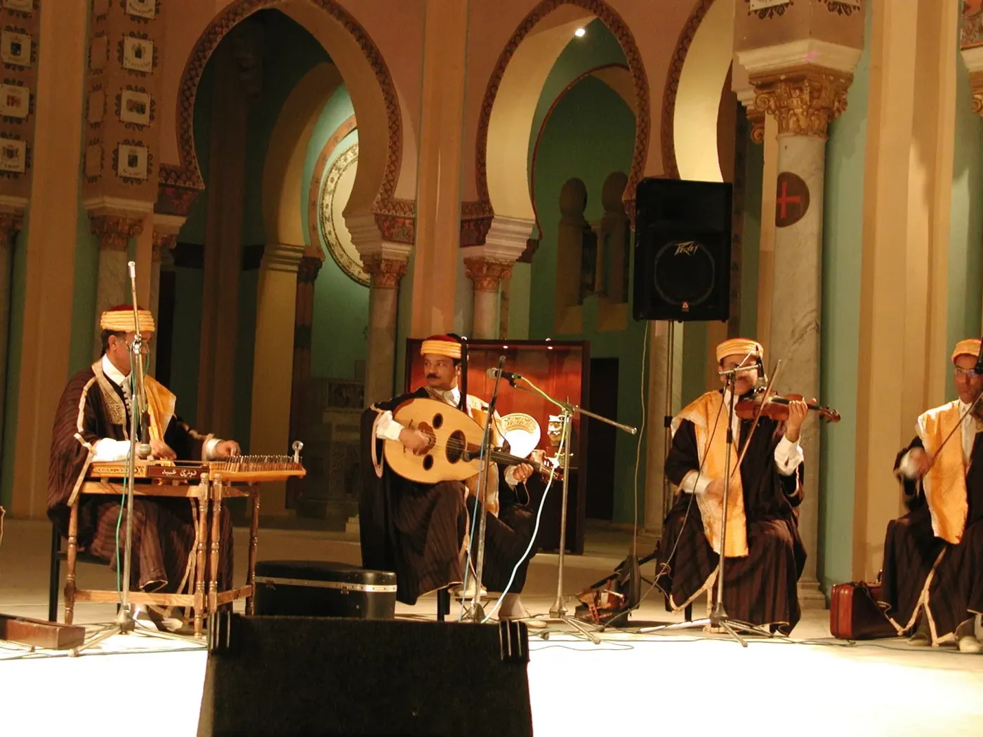 Musicians in traditional dress playing at a tour stop