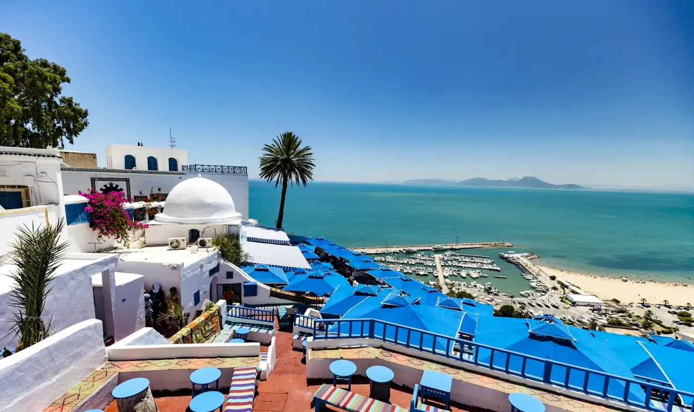 Blue parasols and white domes above the Sidi Bou Said marina
