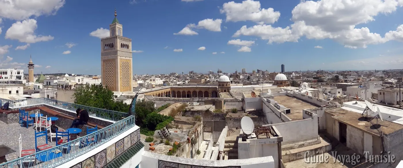 Rooftops of the Tunis medina beneath the minaret of the Zitouna Mosque