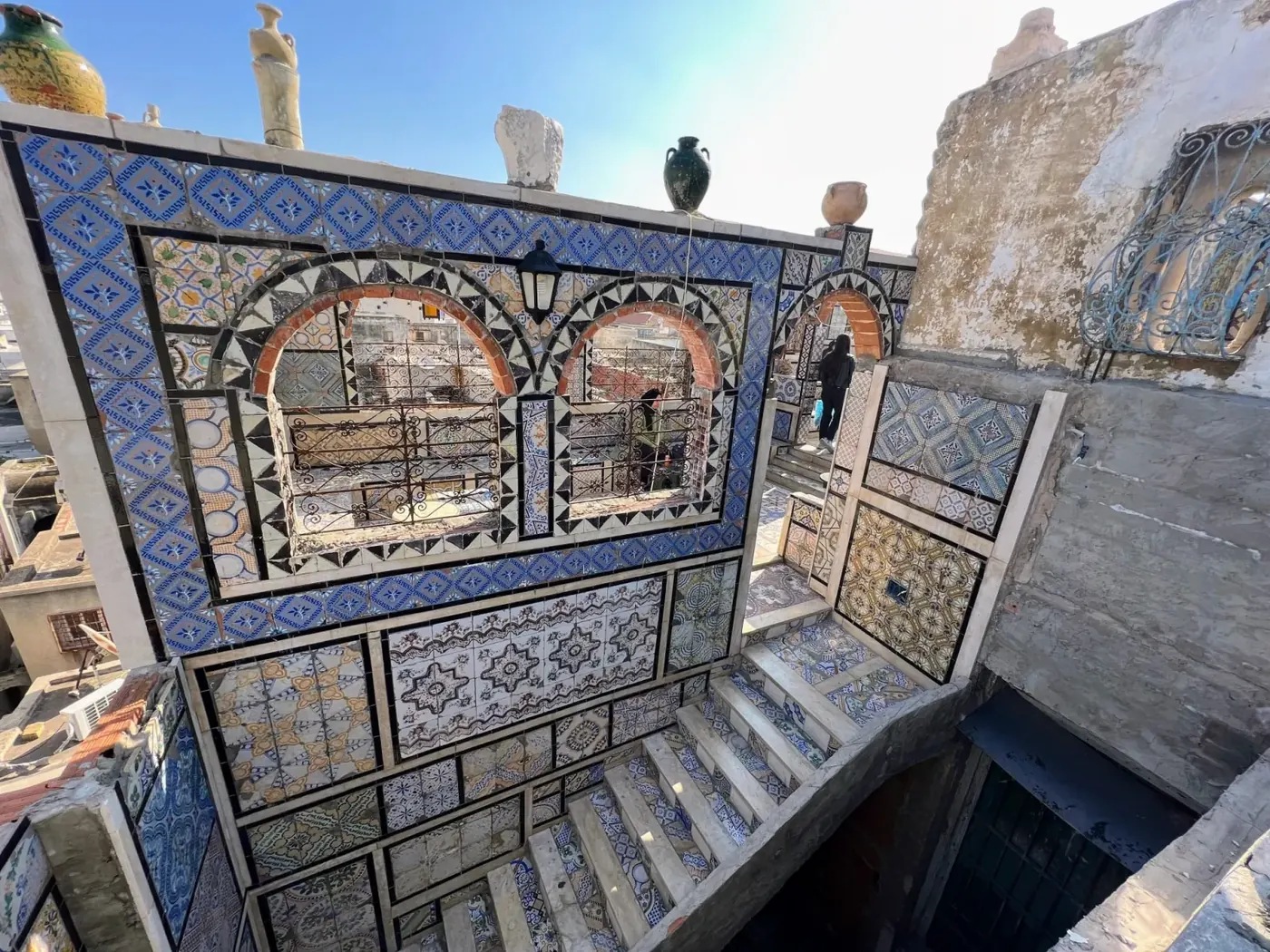 A tiled and painted reception room inside a medina palace