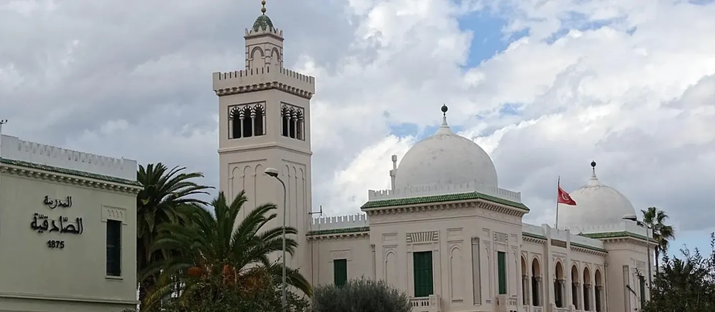 A white colonnaded building with a dome in central Tunis