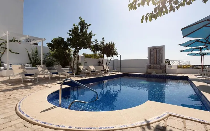 Outdoor pool and sun loungers on the terrace of Dar Said in Sidi Bou Said